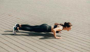 Woman Doing Push-up and functional traing on Pavement